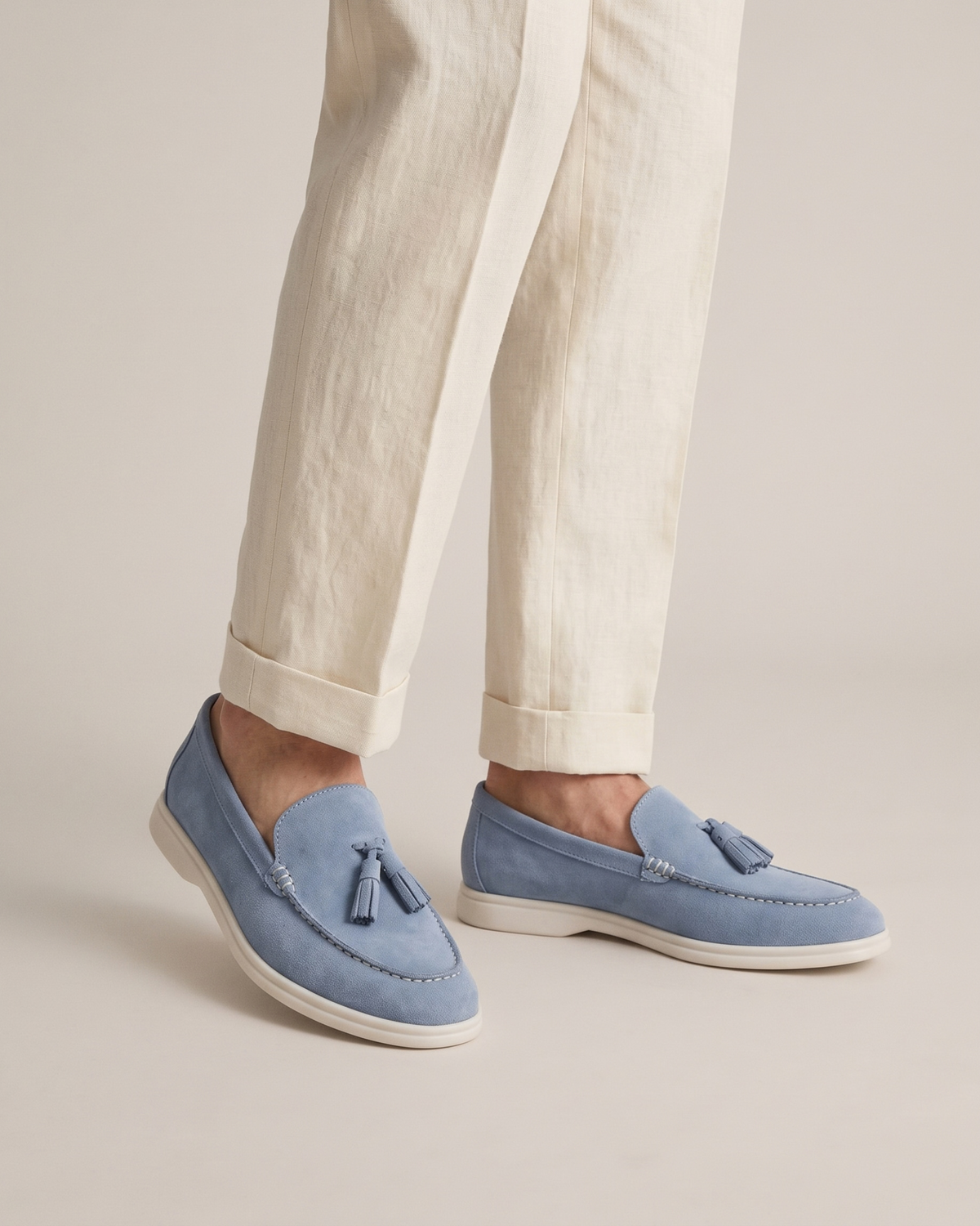 The Emmaus Loafer in Capri Mist, worn with cuffed ivory linen trousers