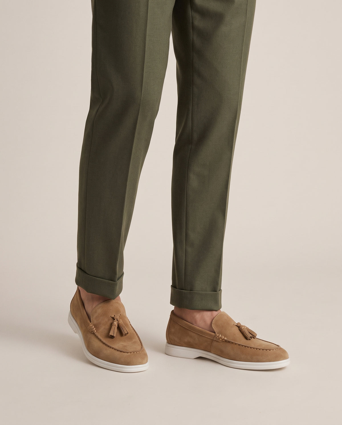 The Emmaus Loafer in Siena Camel, worn with cuffed olive wool trousers