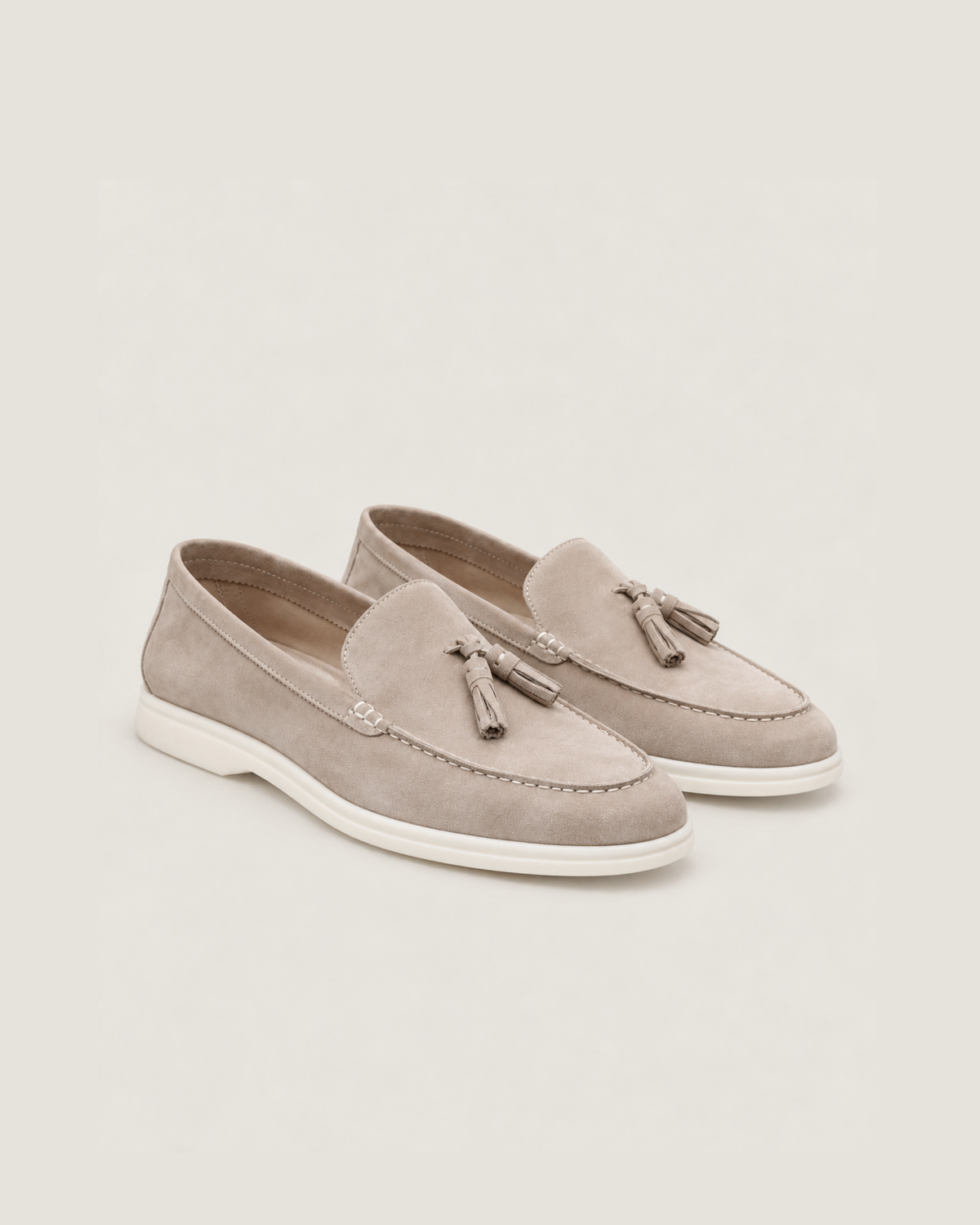 The Emmaus Loafer in Taupe, pair of suede tassel loafers